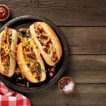 Homemade Hot Chili Dog with Cheddar Cheese and grilled vegetable